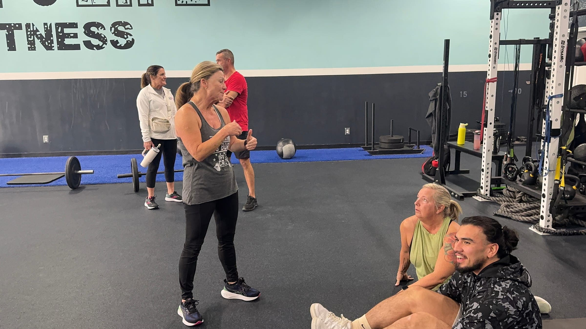 Grit Life Fitness coach keeping a Canton, GA client accountable during a training session